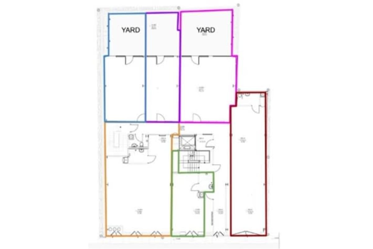 Detailed commercial unit floor plan with enclosed rooms, private yards, garage inside Casco Viejo colonial building Panama