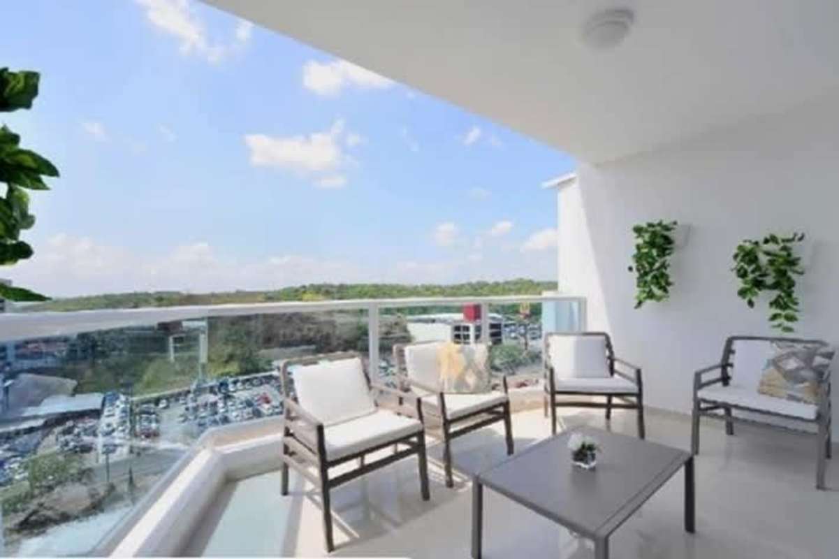 Modern large living and dining space with lots of light and balcony at PH Villa las Fuentes Panama City