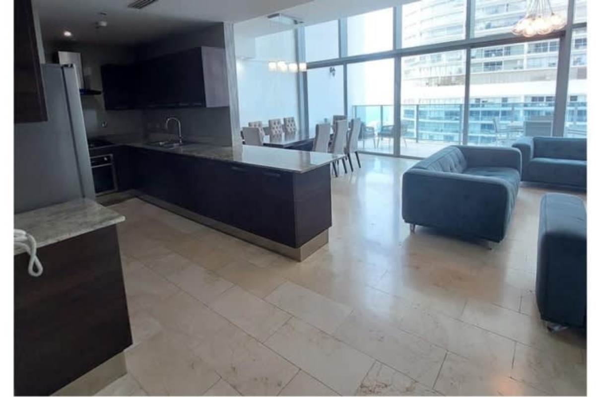 Private balcony with glass railing overlooking Pacific Ocean in Grand Tower Panama City