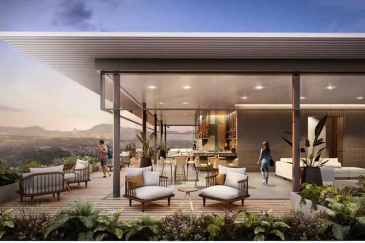 Open-air rooftop lounge area with bar and panoramic views at PH Altamira