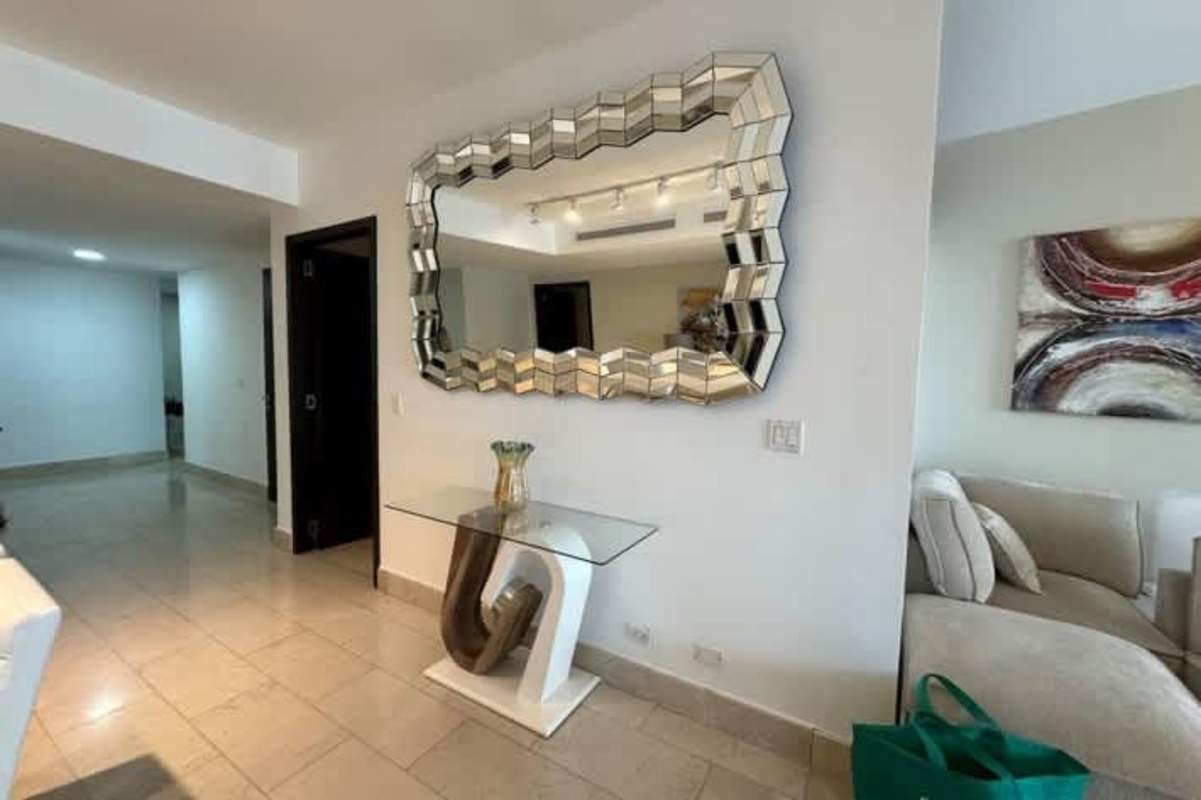 Spacious open kitchen with white cabinetry granite countertops in PH Grand Tower Punta Pacifica Panama