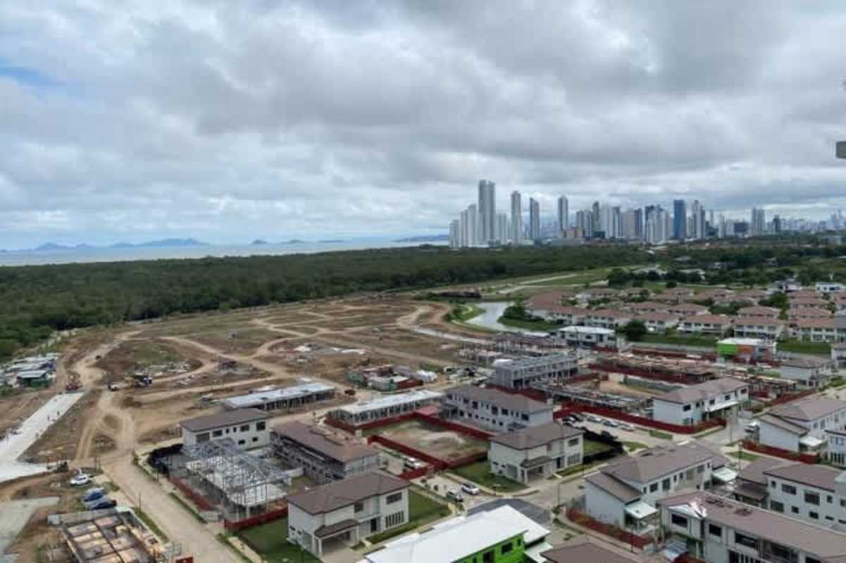 Aerial view of Santa Maria golf community surrounded by luxury condominium towers and golf course