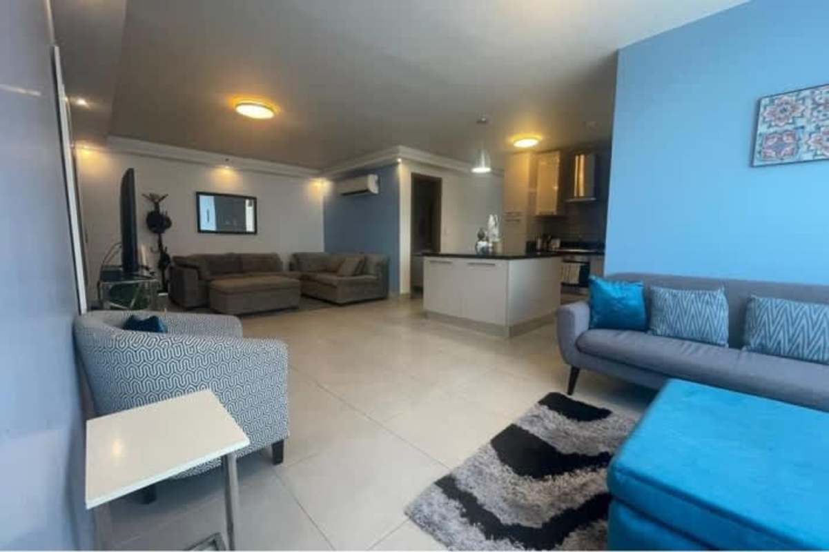 Bright master bedroom with large windows and skyline view in PH Marble Tower Obarrio Panama