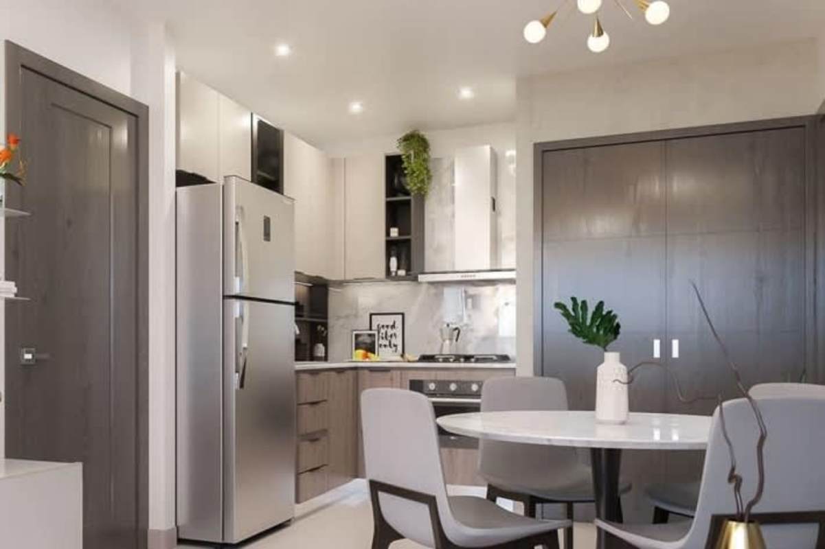 Contemporary kitchen with stainless steel appliances and dining area Park Square Panama City