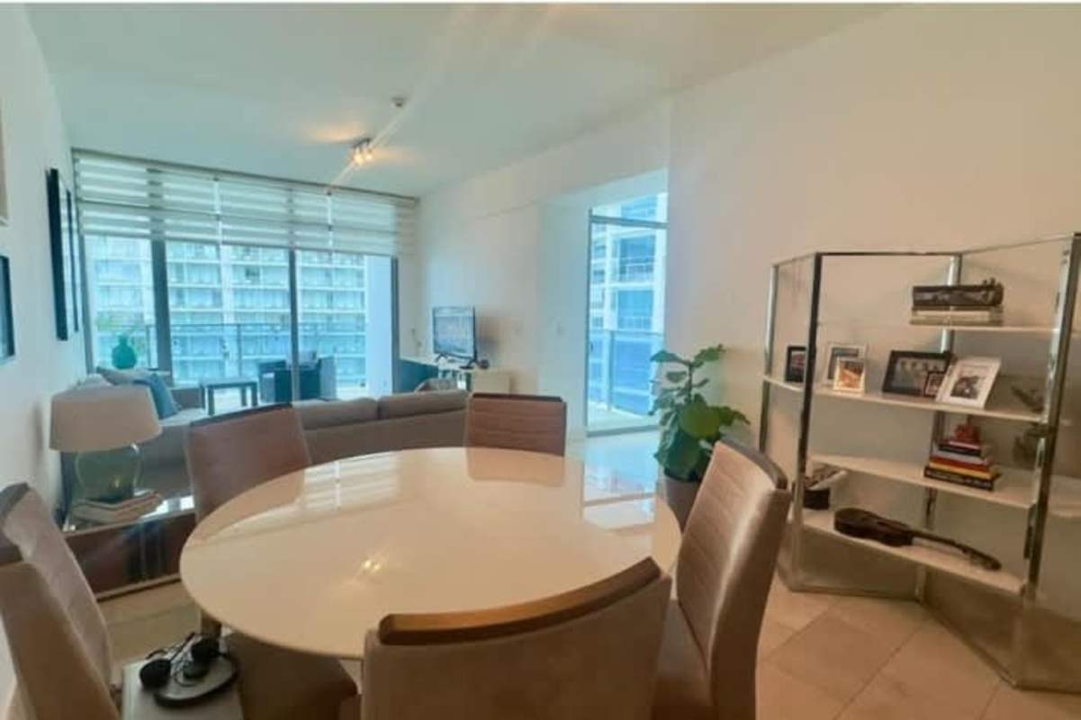 Modern luxury lobby with chandelier and marble floors at Grand Tower Punta Pacifica Panama City