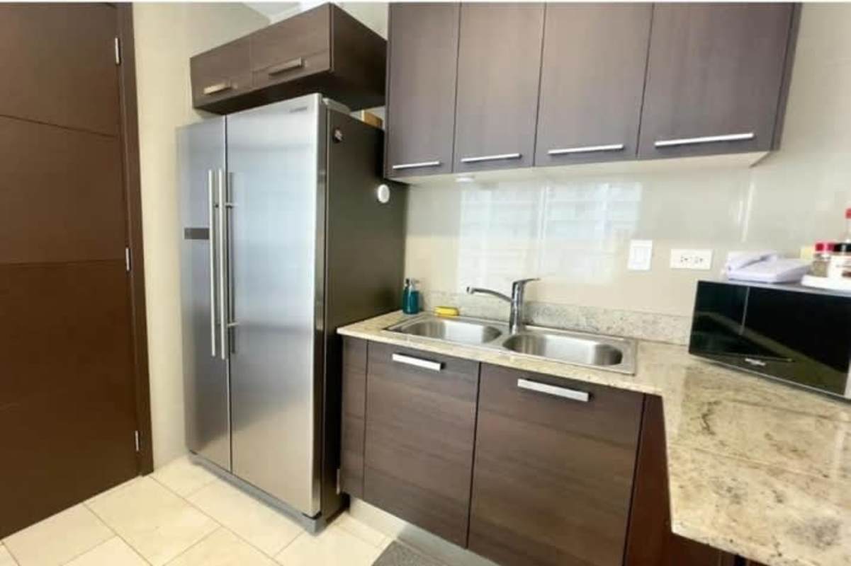 Infinity pool and jacuzzi with Pacific Ocean waterfront view at Grand Tower Punta Pacifica Panama City