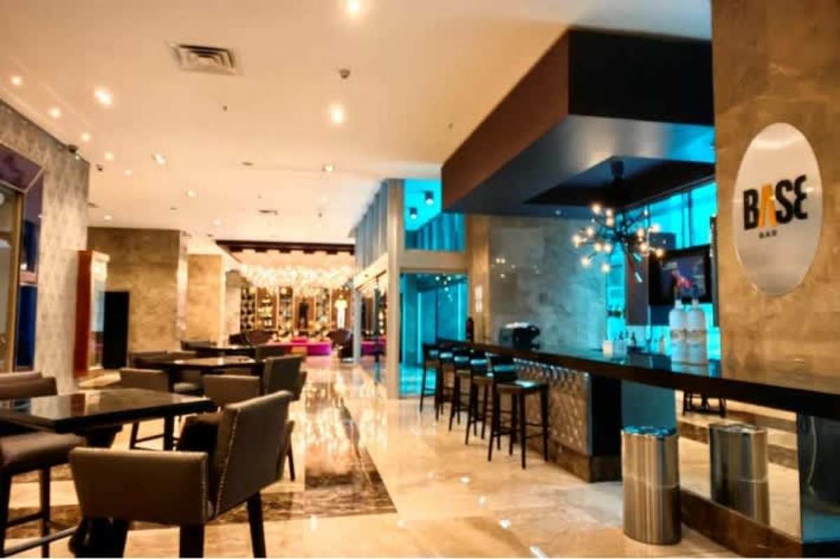 Open plan living room with stylish furnishings and large windows in PH Megapolis Panama