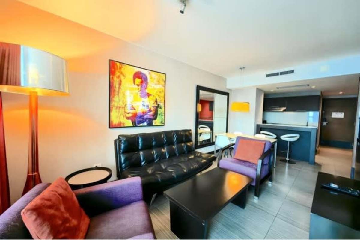 Modern kitchen with granite countertops and integrated appliances at PH Megapolis apartment