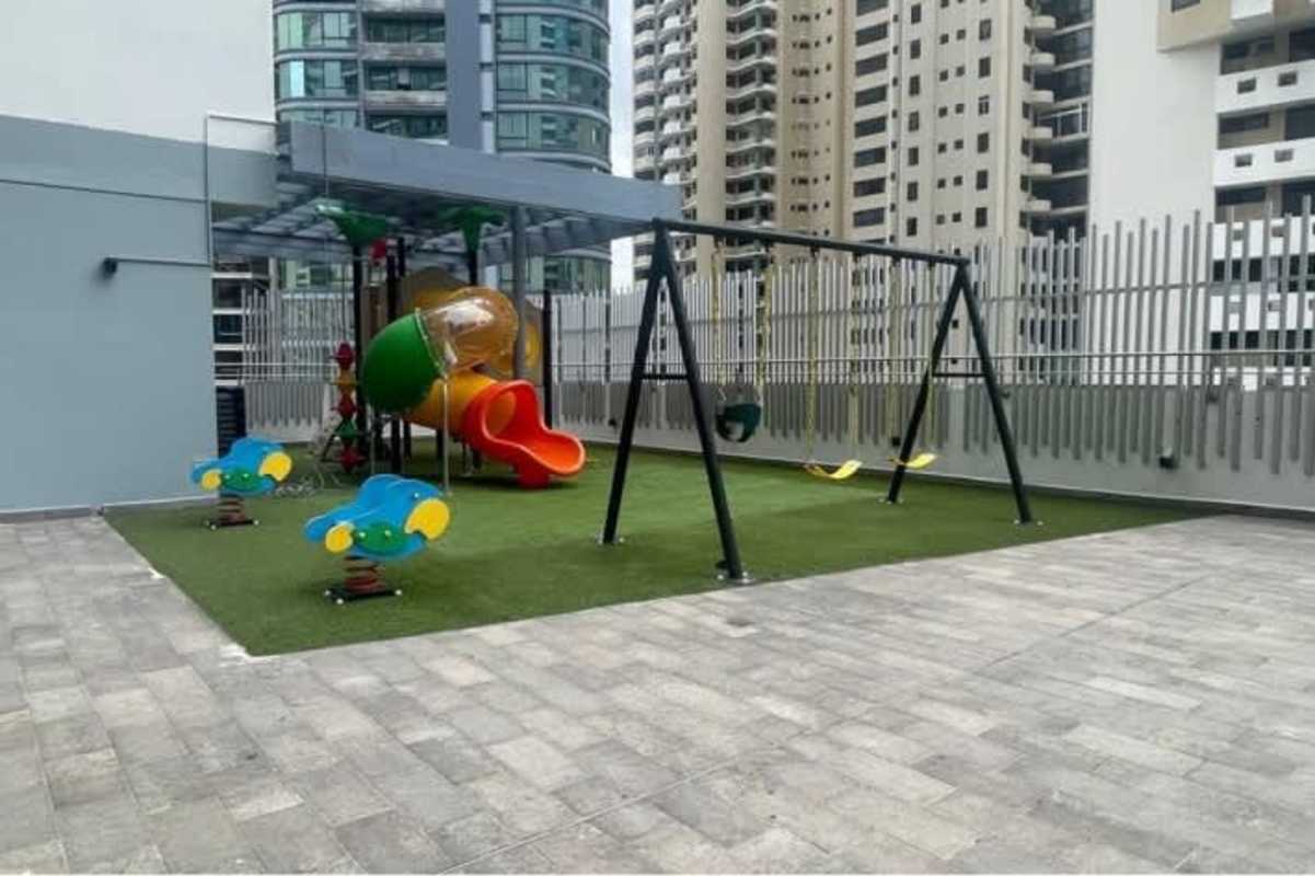 Modern rooftop playground with colorful equipment at PH Pacific View Panama City