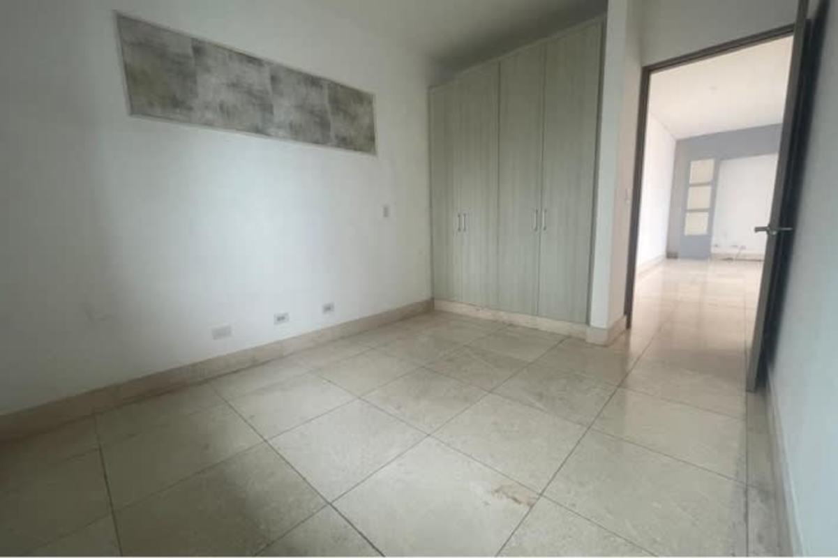 Bright bedroom with large window cityscape views PH Pacific View Paitilla Panama