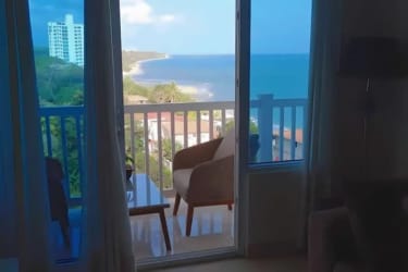 Bedroom with ocean view window in PH Ibiza San Carlos Panama beachfront rental apartment