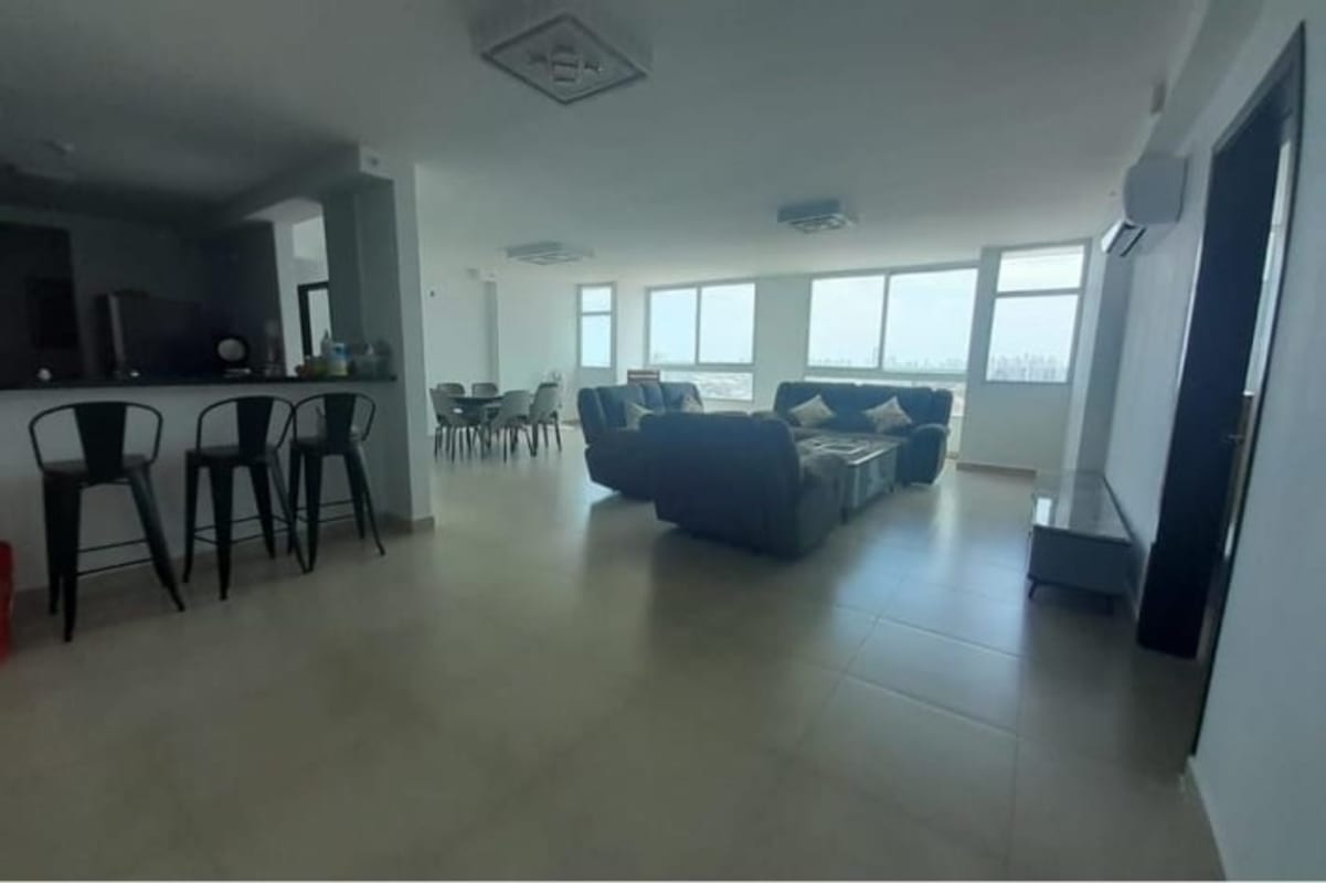 Bright open-plan living dining with panoramic city view PH Country Heights Panama