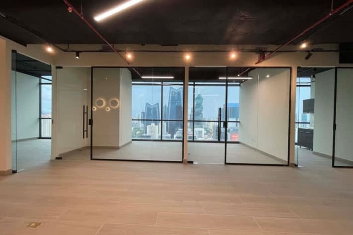 Modern furnished office with glass walls and skyline view in Panama's Financial District