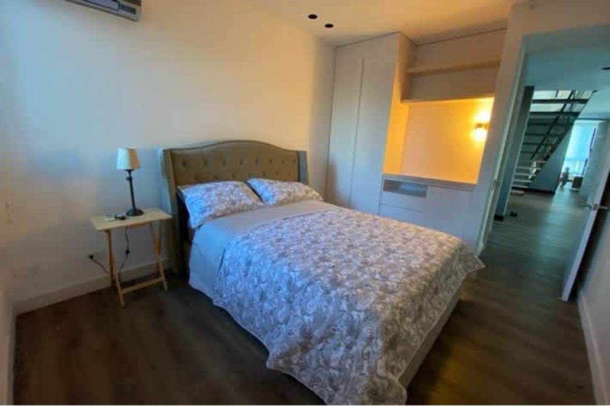 Minimalist bedroom with upholstered bed, built-in closet, sea view window, PH Serenade Costa del Este Panama