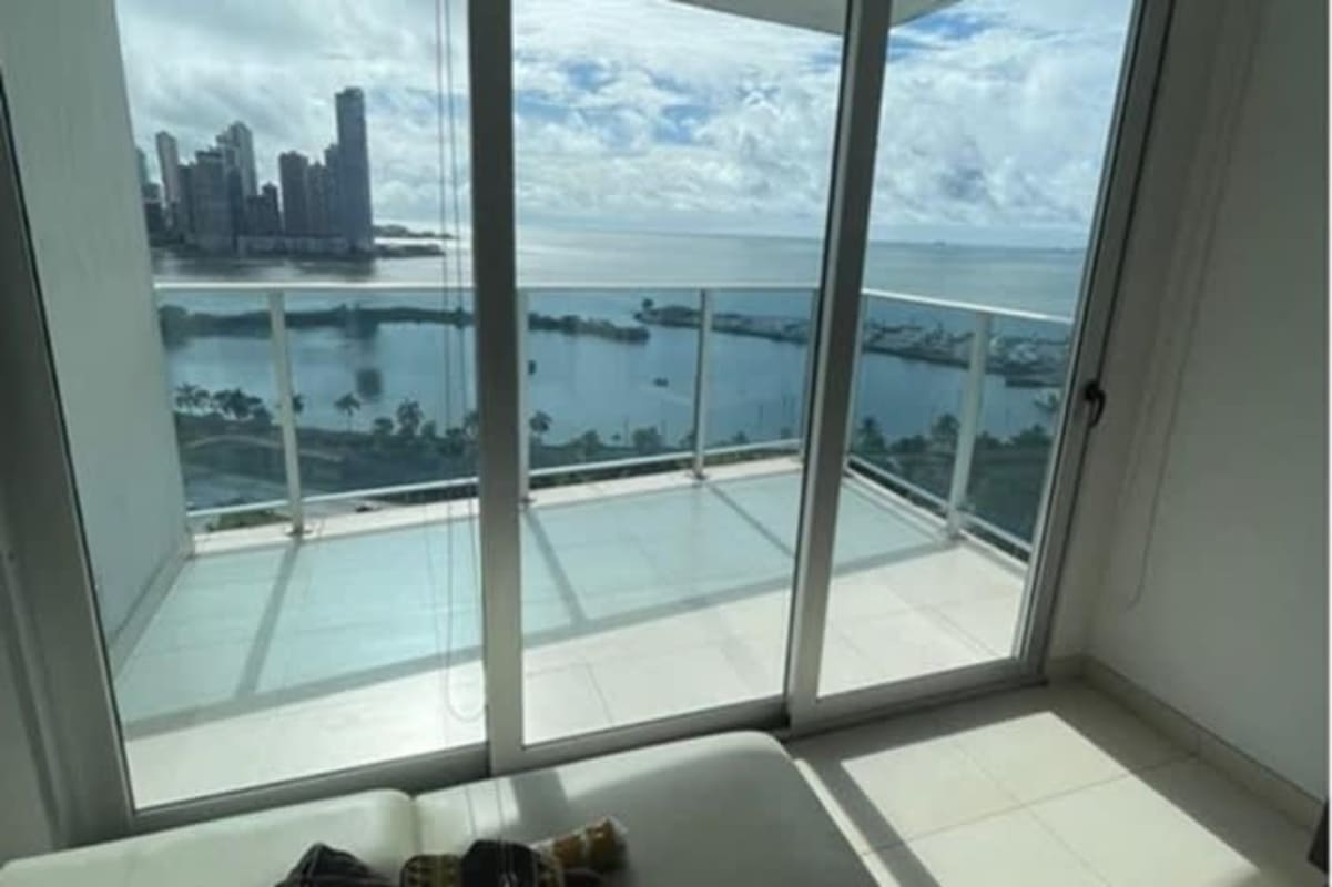 Glass balcony terrace with ocean and city views in PH Marina Plaza Avenida Balboa Panama