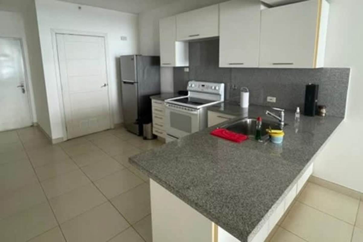 Modern bedroom with large windows overlooking city skyline and ocean PH Marina Plaza Panama