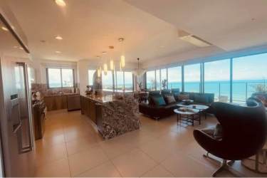 Open kitchen with large island, quartz counters and ocean views Punta Caelo Panama