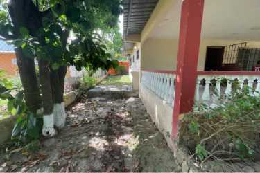 Covered front porch lush garden peaceful setting house for sale Nueva Gorgona Panama