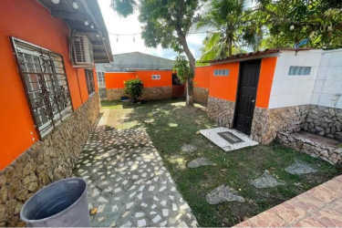 Private backyard with swimming pool tiled deck and garden at coastal house for sale Gorgona Panam