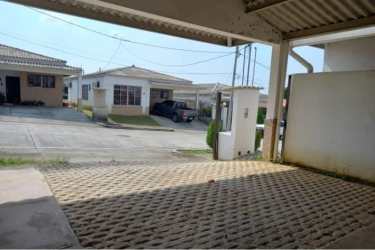 Front facade of single-story 3-bedroom home with carport at Parques de Oviedo in Arraiján Panama