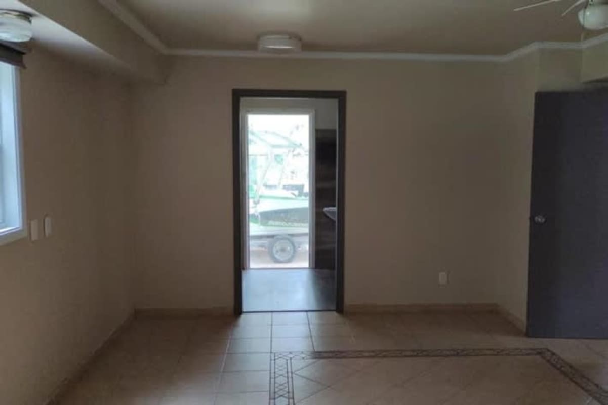 Bedroom with wood flooring, air conditioning, and large closet in Clayton family house for rent