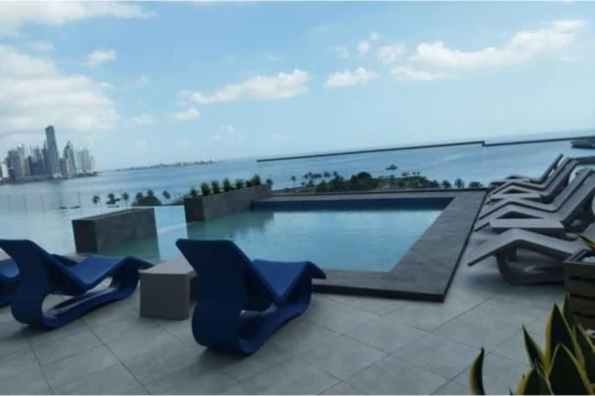 Rooftop infinity pool overlooking Panama City skyline and ocean in The Sands Tower Avenida Balboa
