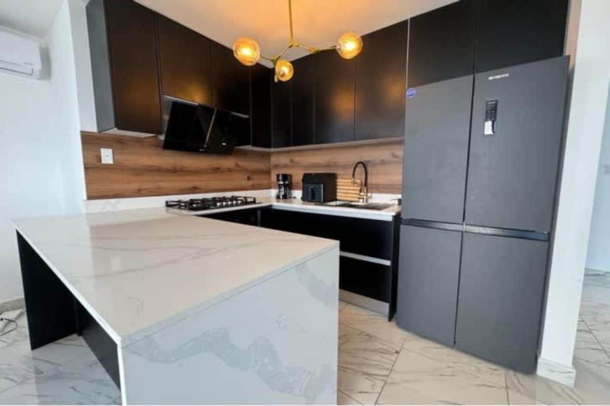 Large balcony with glass railing offering ocean and skyline vistas in The Sands Tower Avenida Balboa Panama City