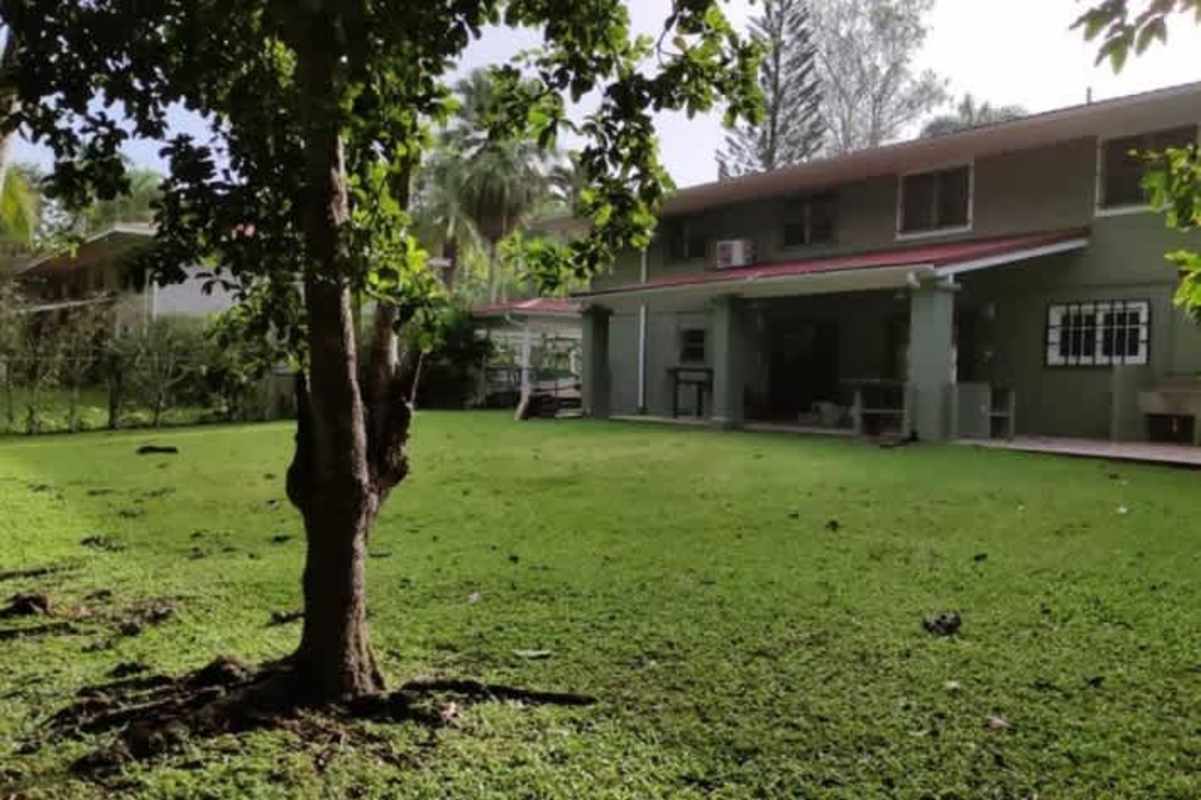 Large bedroom walk-in closet wood floors lush views home Clayton Panama Hola Realty