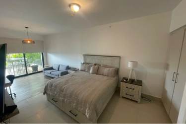 Spacious master bedroom with large bed balcony access and sea views Punta Caelo Panama