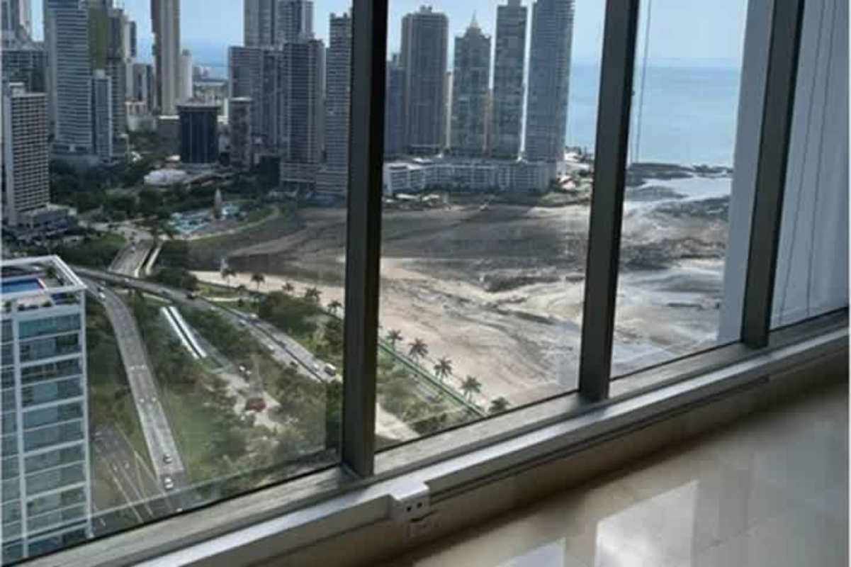 Office interior with large panoramic windows overlooking Pacific Ocean in PH BICSA Tower Panama City