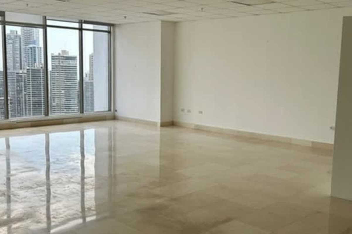 Office interior with panoramic windows facing ocean skyline PH BICSA Panama
