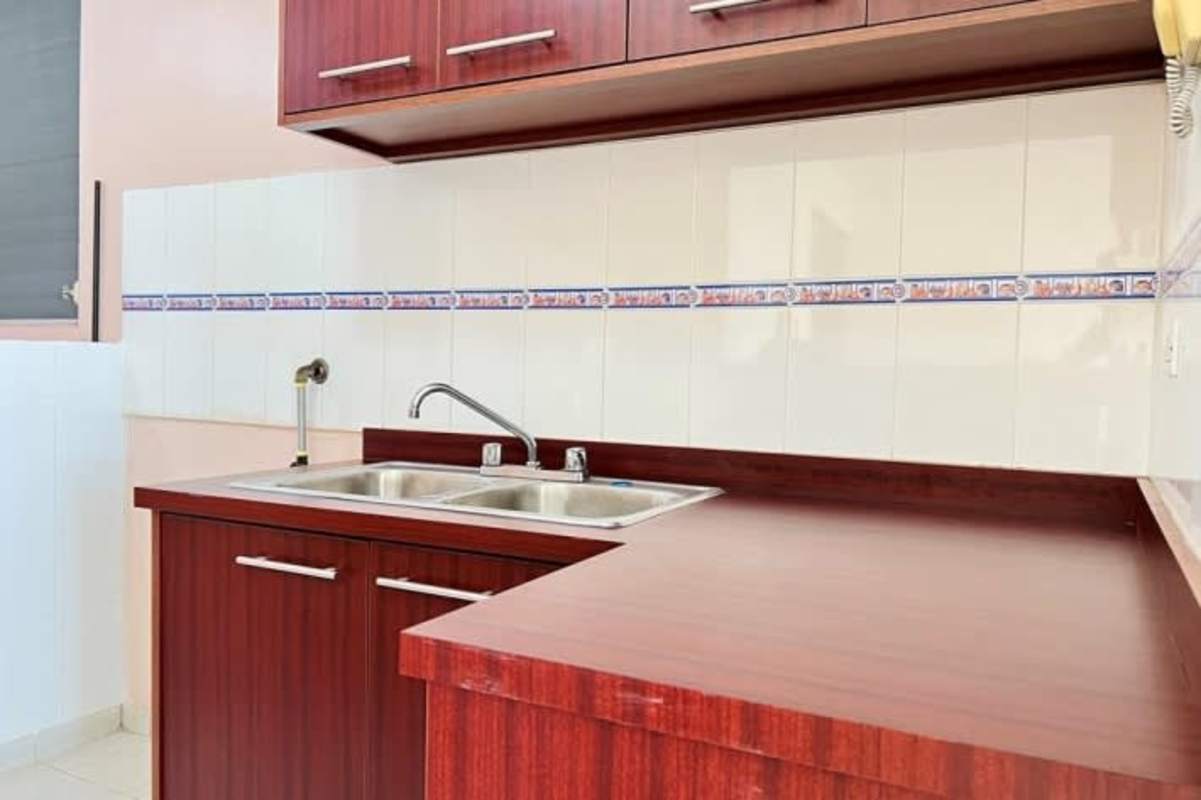 Empty bedroom with built-in sliding closet doors in Río Abajo apartment for rent