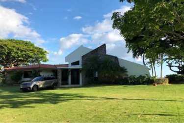 Bedroom with bunk beds, sea view window, white loveseat sofa at luxury beachfront home Panama