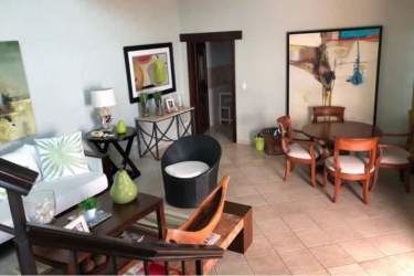 Contemporary living dining room with tile floors, wall art in beachfront rental home Costa Esmeralda Panama