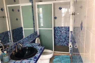 Spacious sunlit bedroom, large window garden view in beach house rental Costa Esmeralda Panama