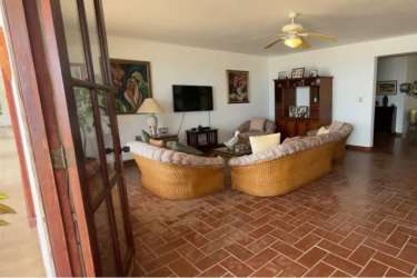 Classic kitchen with island, white cabinetry, and ample counter space in a luxury Panama beachfront estate
