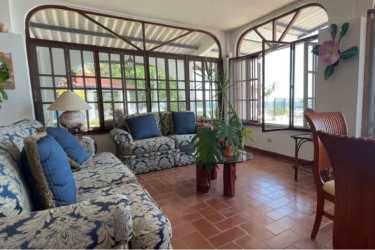 Spacious living room with tile floors, arch windows, ocean views in beachfront estate Rio Hato Panama