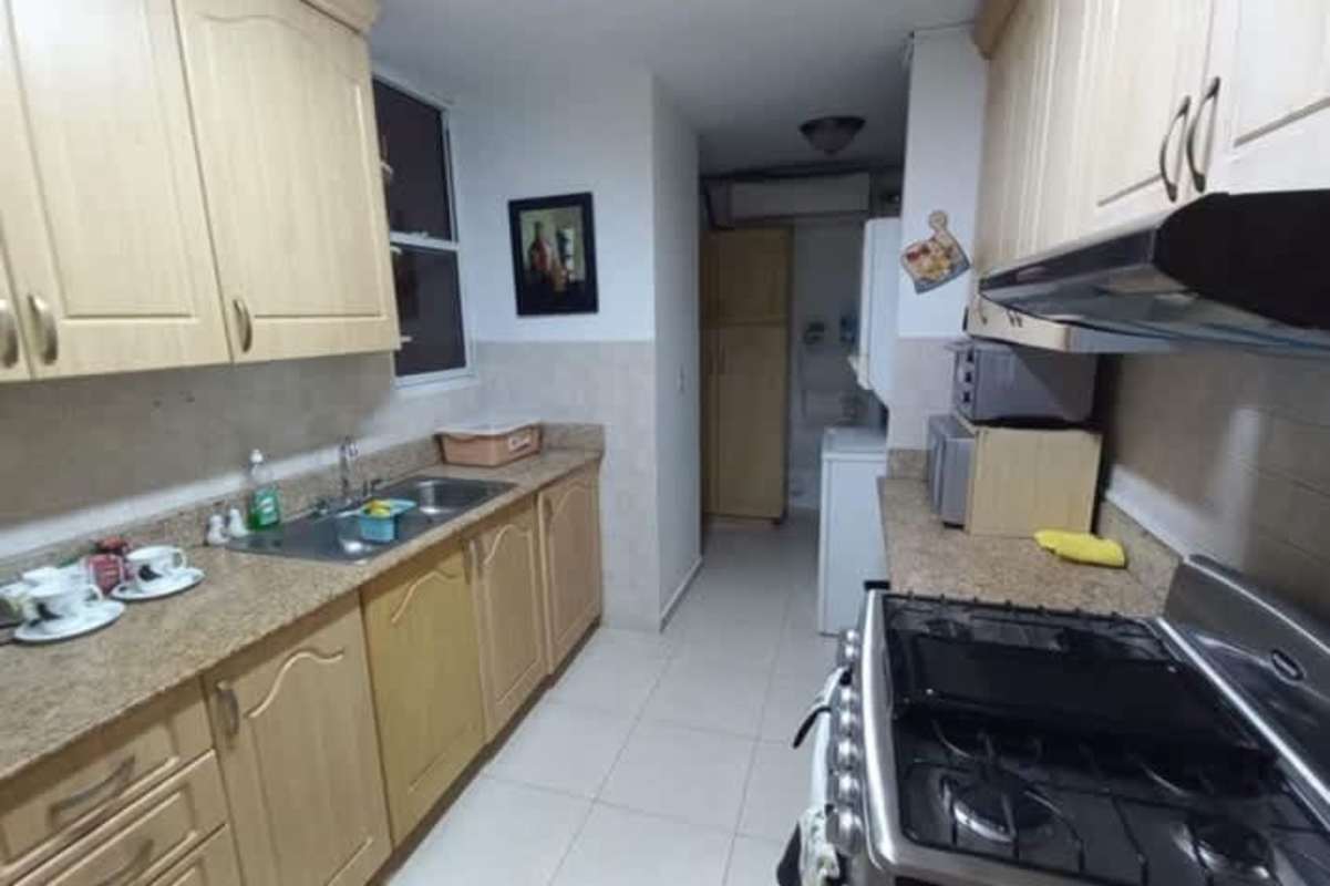 Contemporary dining room with large windows curtains exposed brick wall PH Dos Mares View 1 Panama
