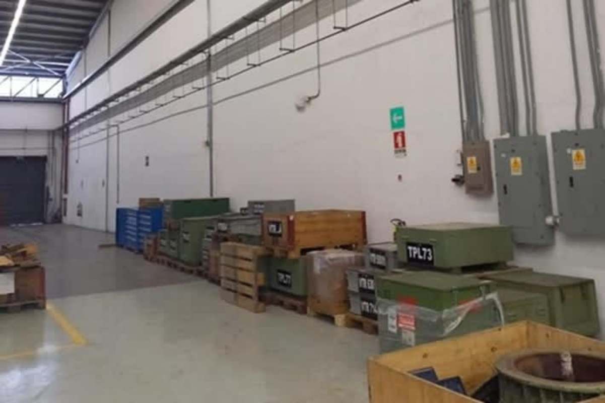 Industrial warehouse interior with high clearance, pallets and lighting at Parque Industrial Milla 8 Panama