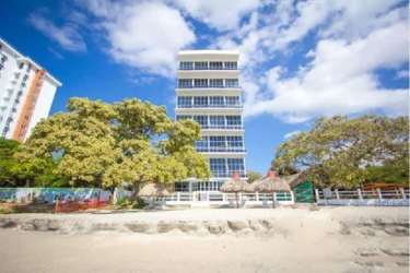 Kitchen with granite counter, stainless appliances and breakfast bar at PH Miramar Loft Farallón