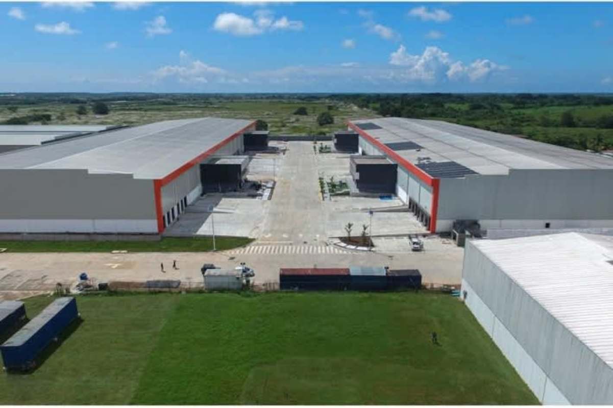 Loading zones and wide driveway of industrial warehouse complex with multiple ramps and access points