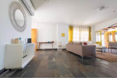 Spacious living room with panoramic windows and ocean views in luxury oceanfront duplex Playa Blanca Panama