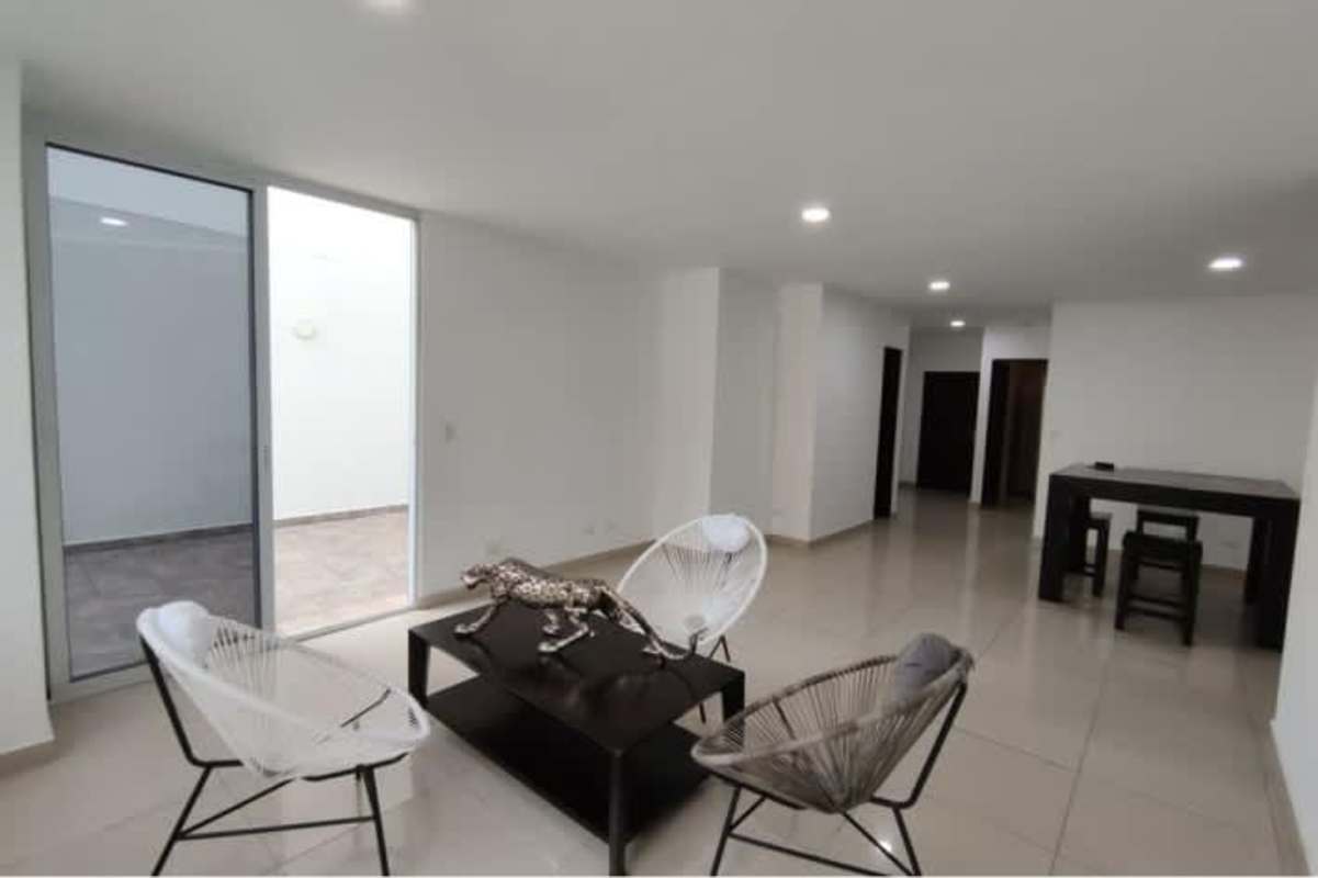 Bedroom with tile floors, ensuite bath, windows overlooking city PH Sky Blue San Francisco Panama