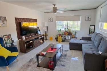 Covered gazebo patio beside swimming pool and garden at Nueva Gorgona house Chame