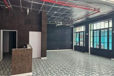 Industrial interior with natural light, black walls, exposed ceiling in Santa Ana Panama City