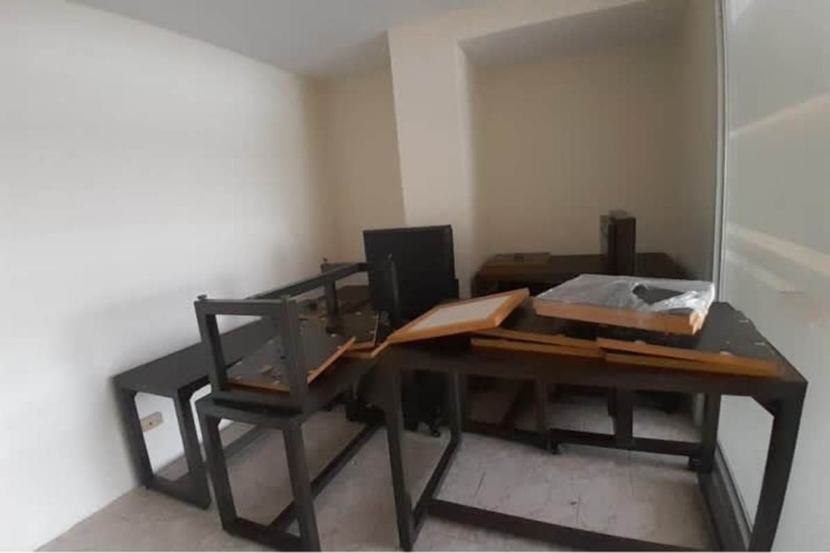 Functional commercial bathroom with toilet and soap dispenser inside commercial unit Panama City