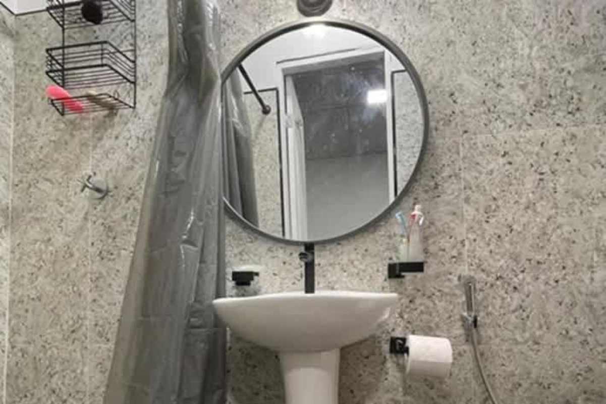 Modern minimalist kitchen with black cabinets and counter in investment property Panama