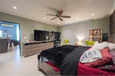 Dining area with sliding doors to private pool in Playa Blanca beach home