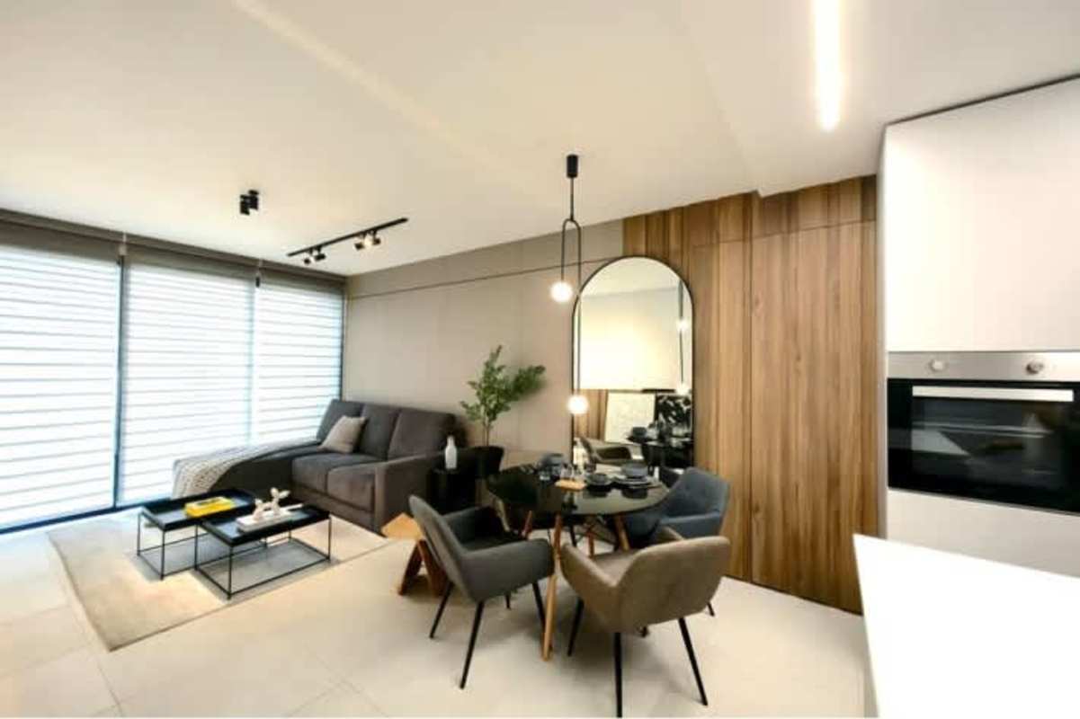Spacious living dining with floor to ceiling windows and balcony new apartments in Coco del Mar