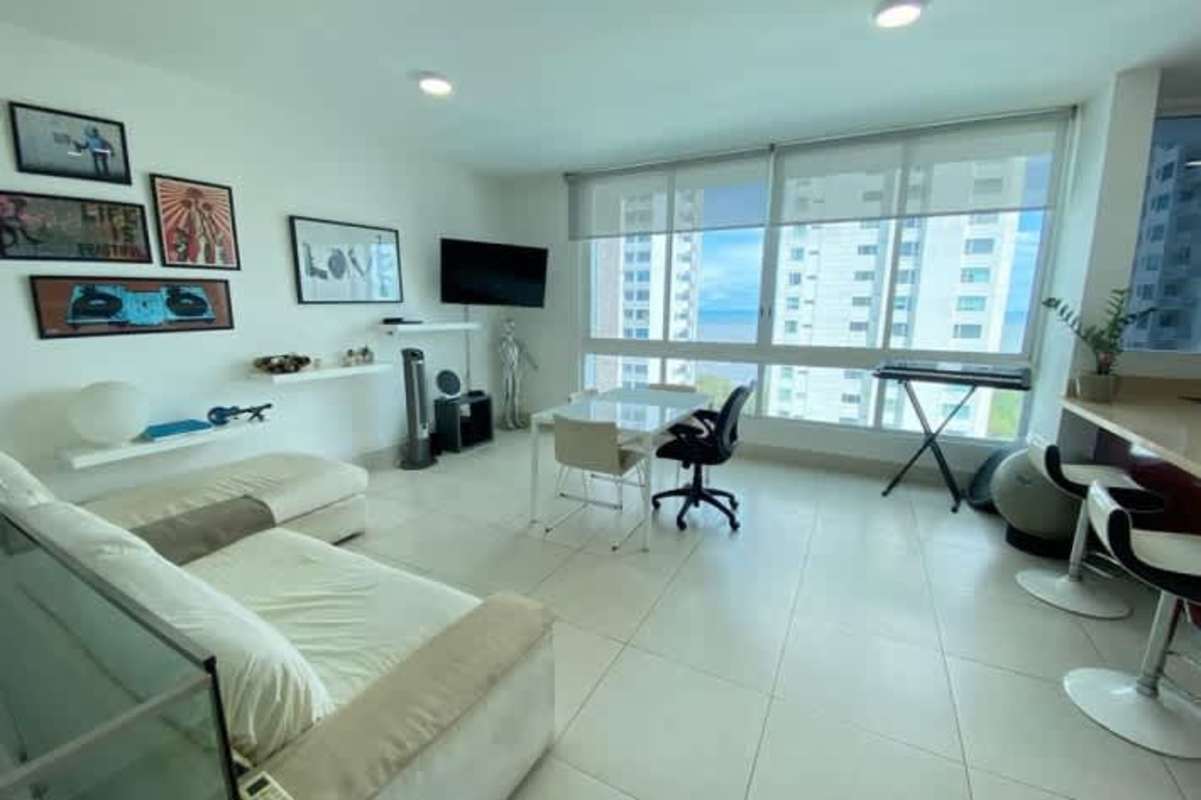 Open plan living room, workspace and panoramic views Costa del Este Panama loft apartment for sale